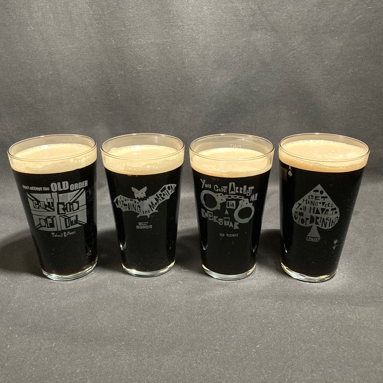 A mixed set of 4 Vinyl Revolution glasses (one of each)