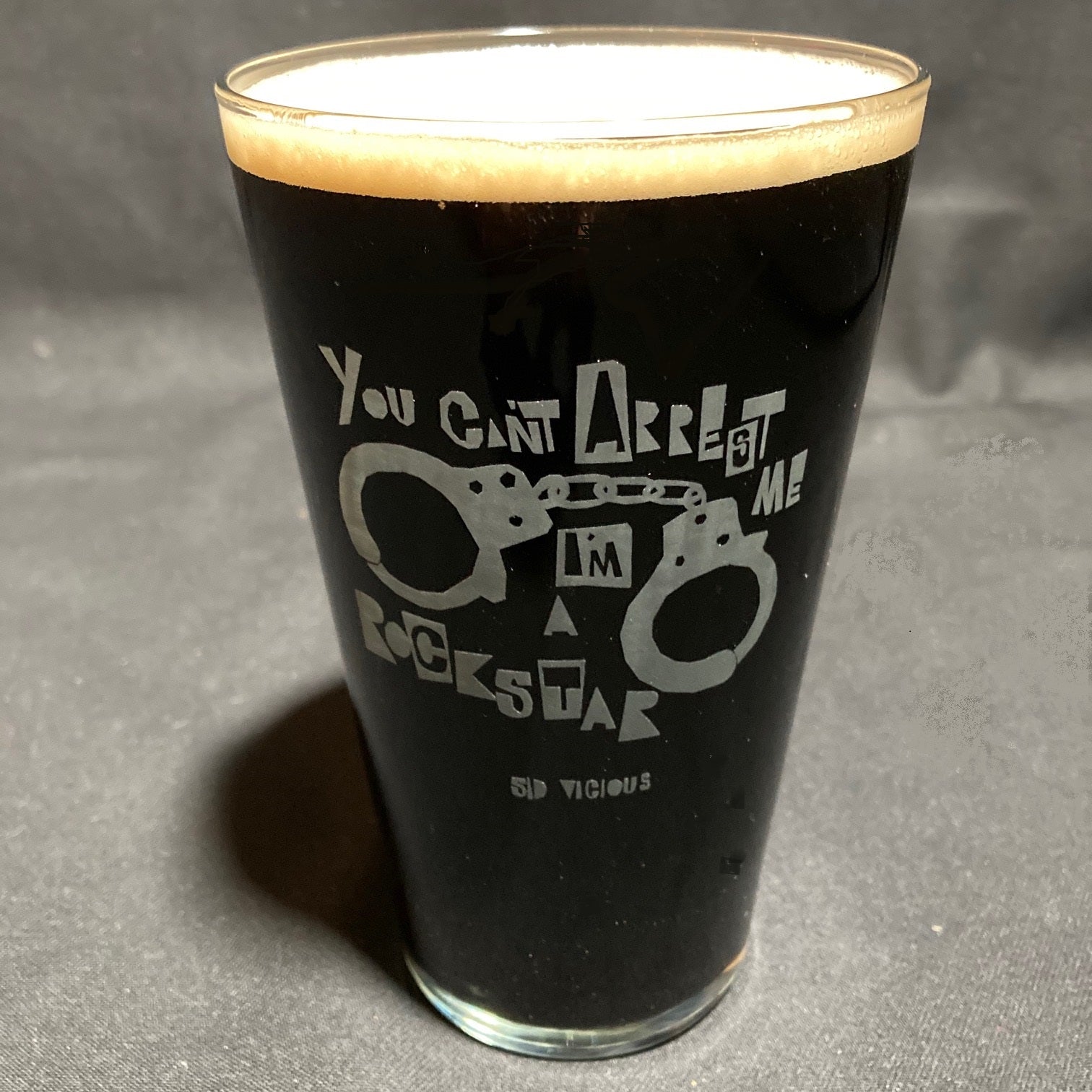 A set of 4 Vinyl Revolution beer glasses featuring a quote from Sid Vicious